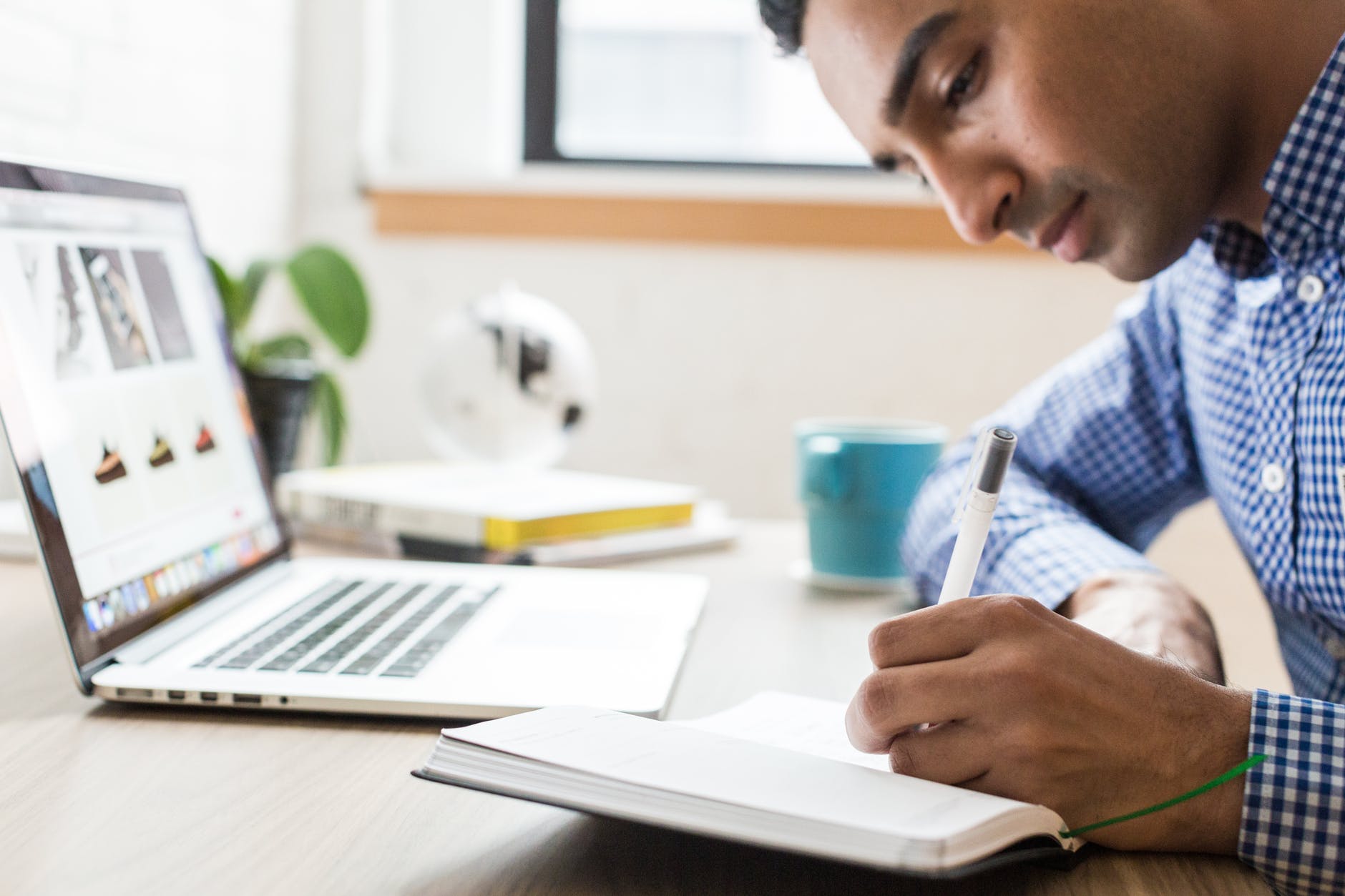 man studying using a laptop