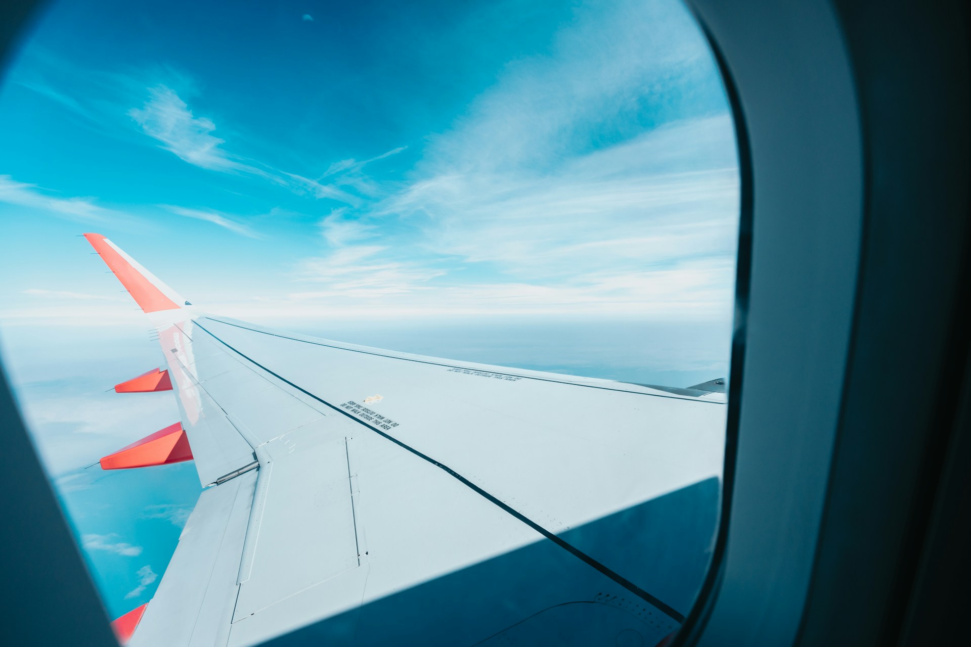 The wing of an airplane as viewed from the window