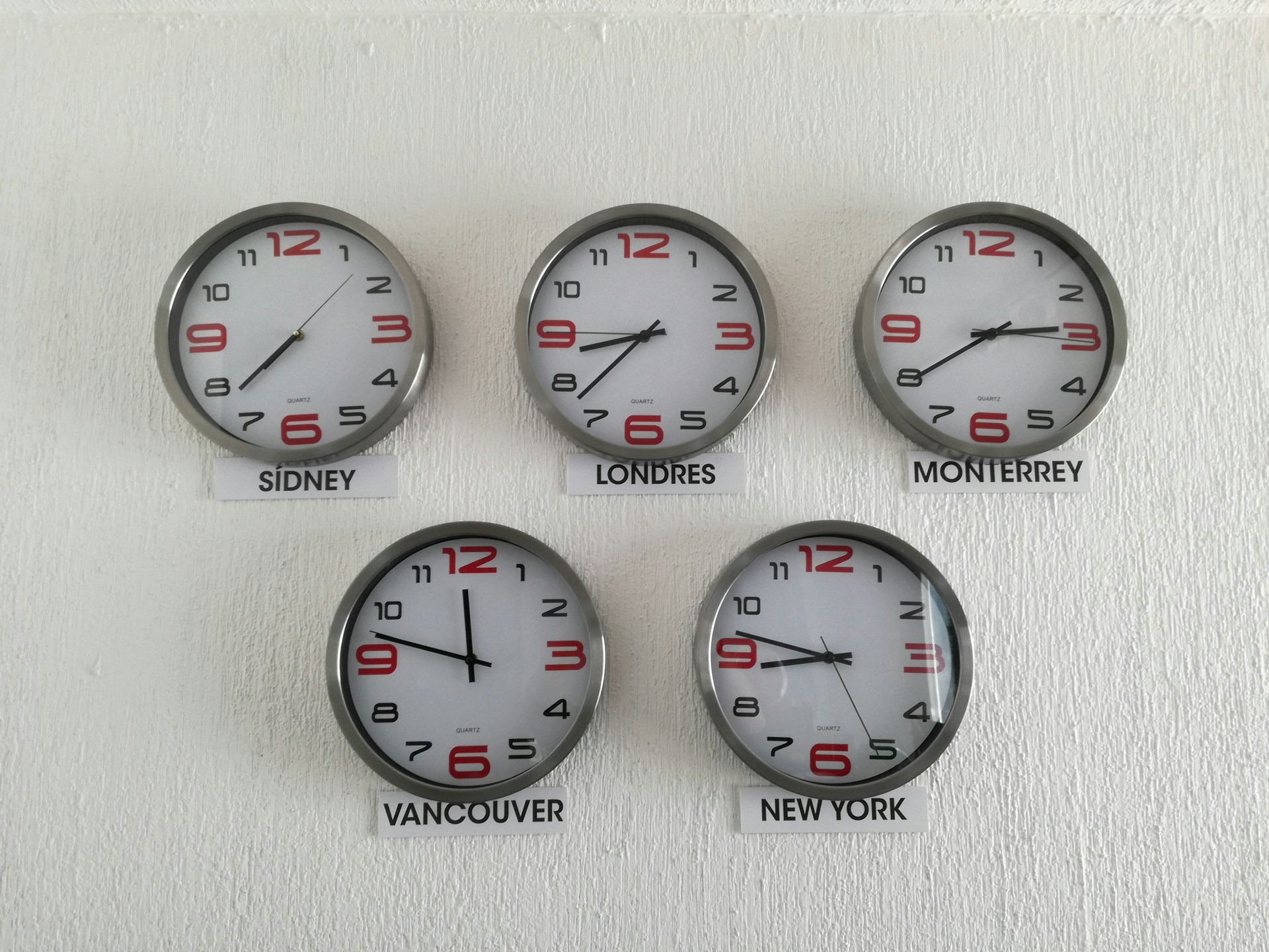 six clocks showing different time zones