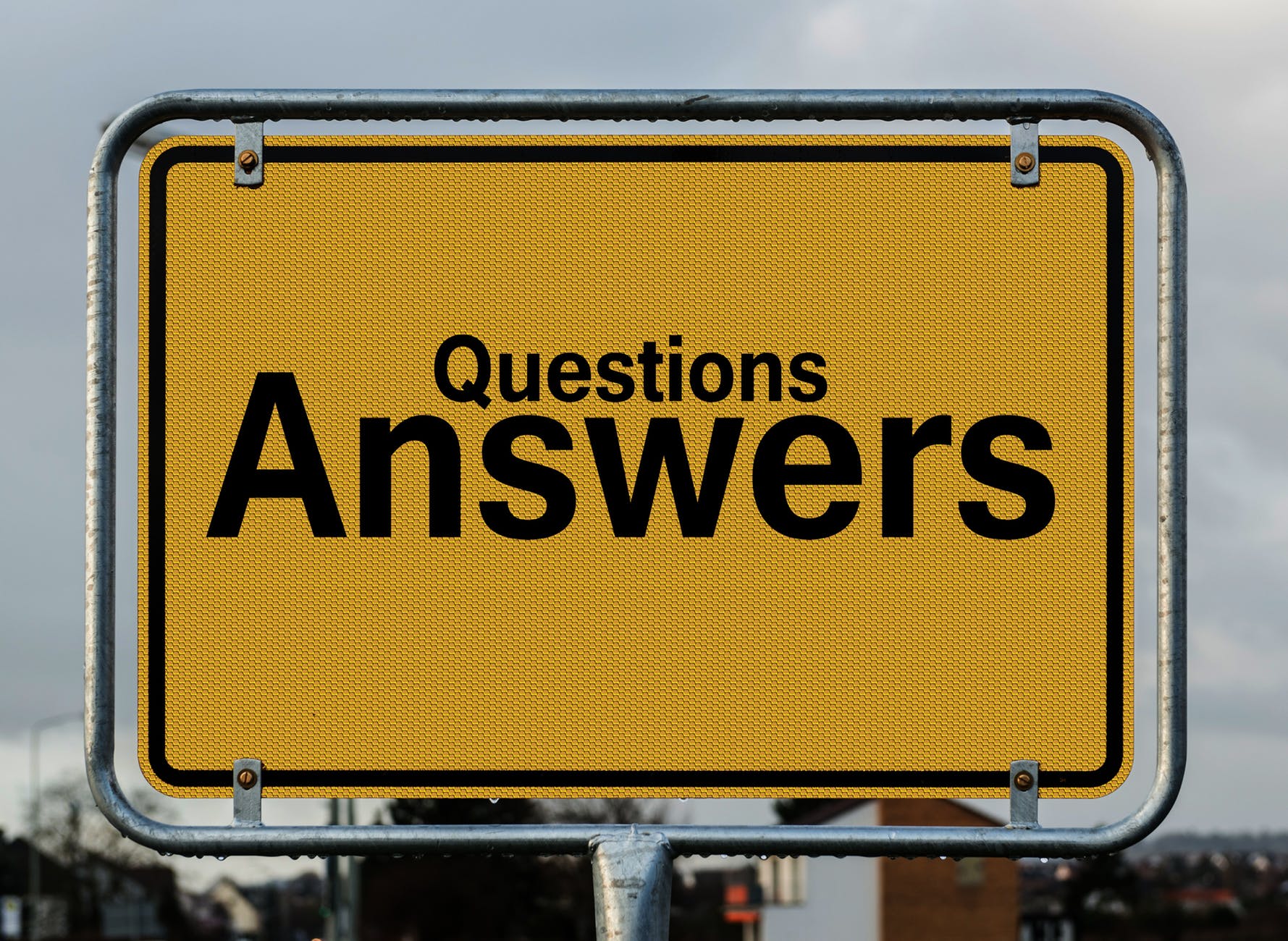 yellow road sign saying 'questions answers'