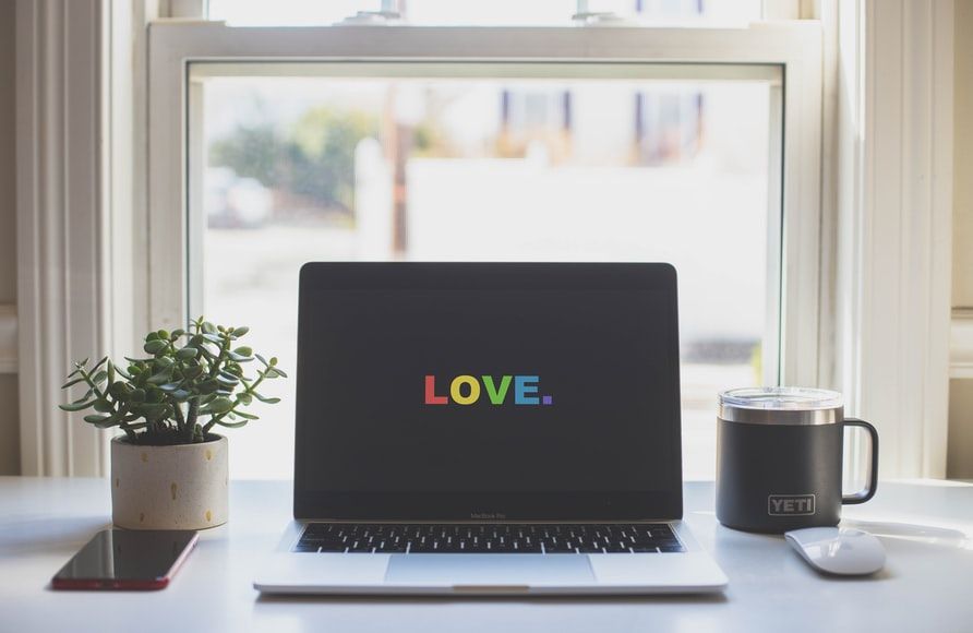 the word love on laptop screen