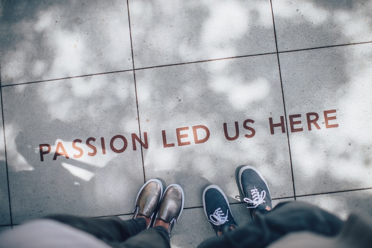 wording on a floor saying 'passion led us here'