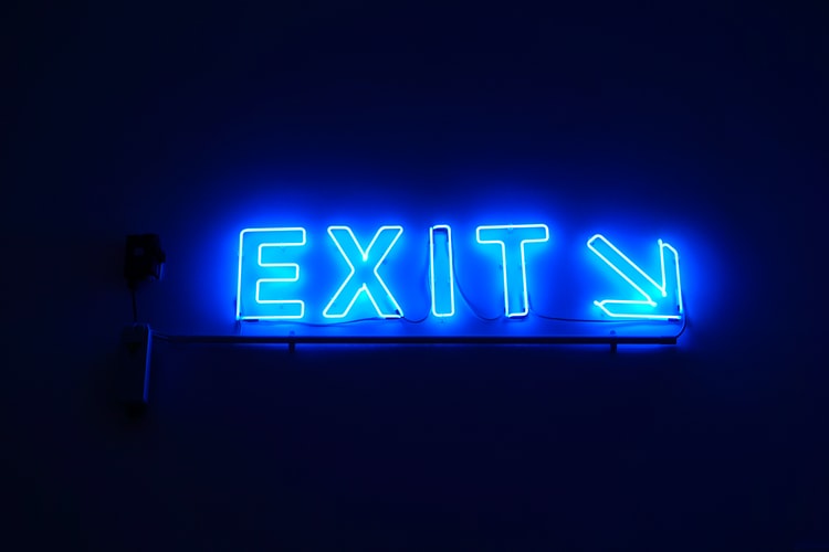 blue neon exit sign