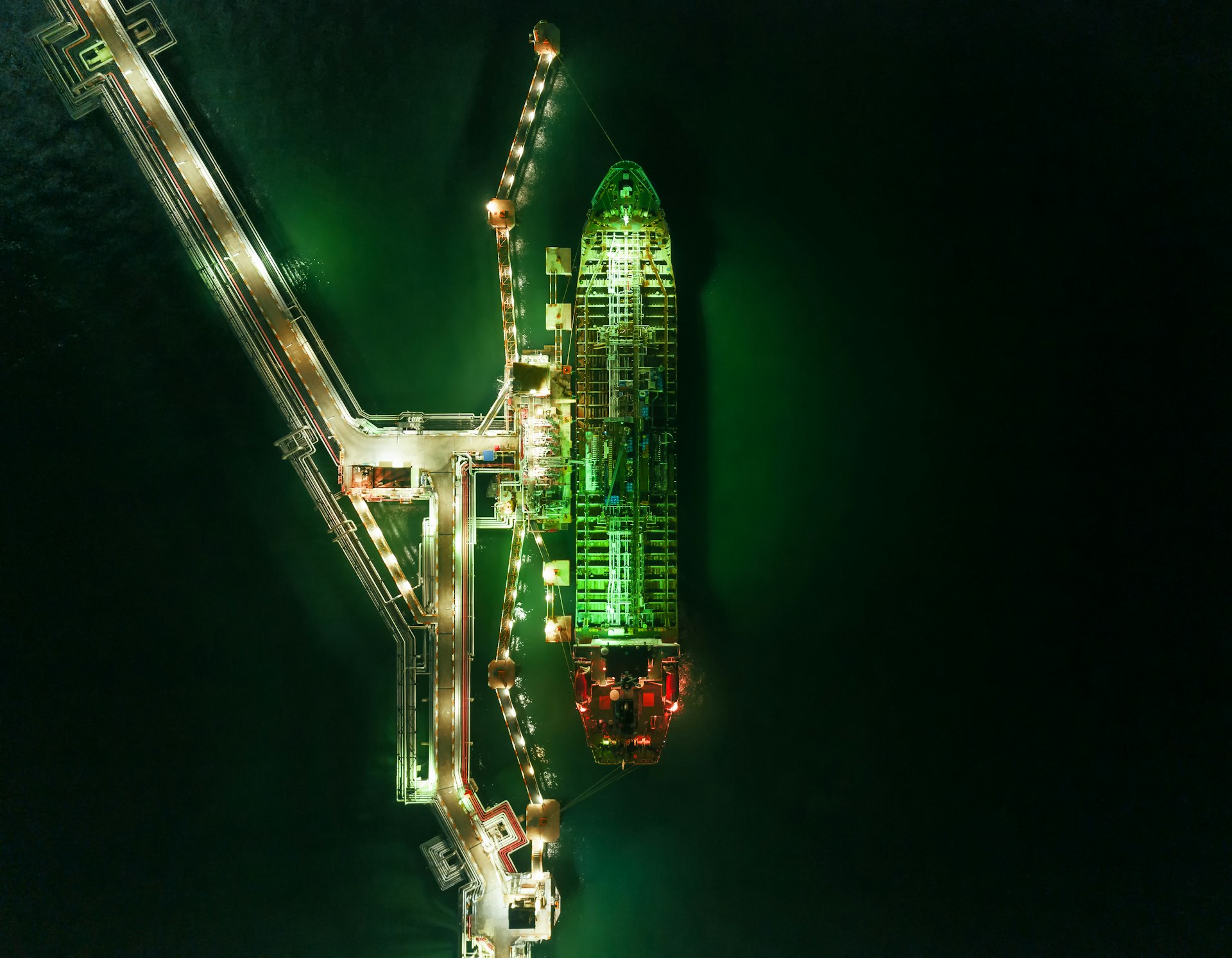 aerial view of an LPG tanker at a dock at night