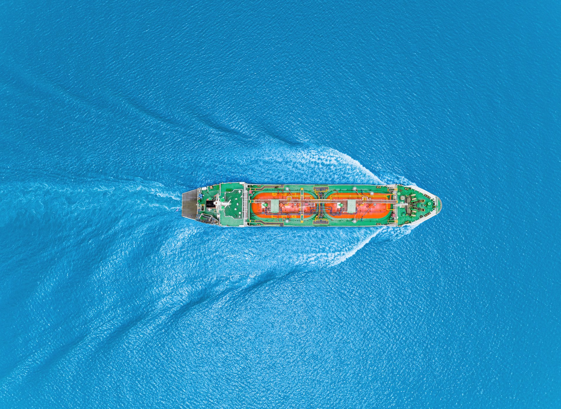 aerial view of an LNG or LPG tanker in a blue sea