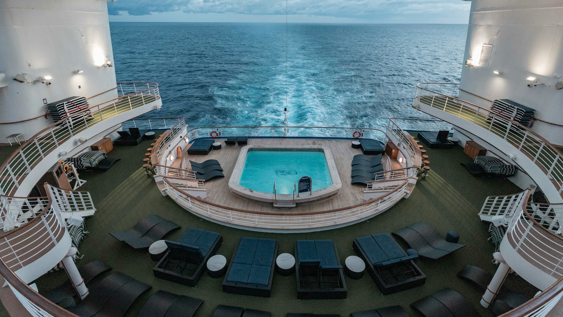 a swimming pool on the deck of a cruise ship