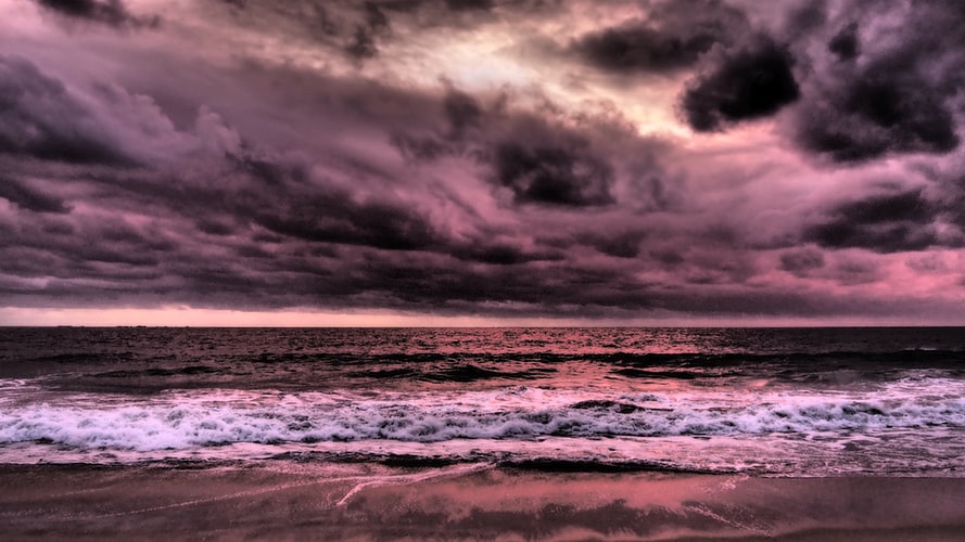 a purple stormy sky over the ocean