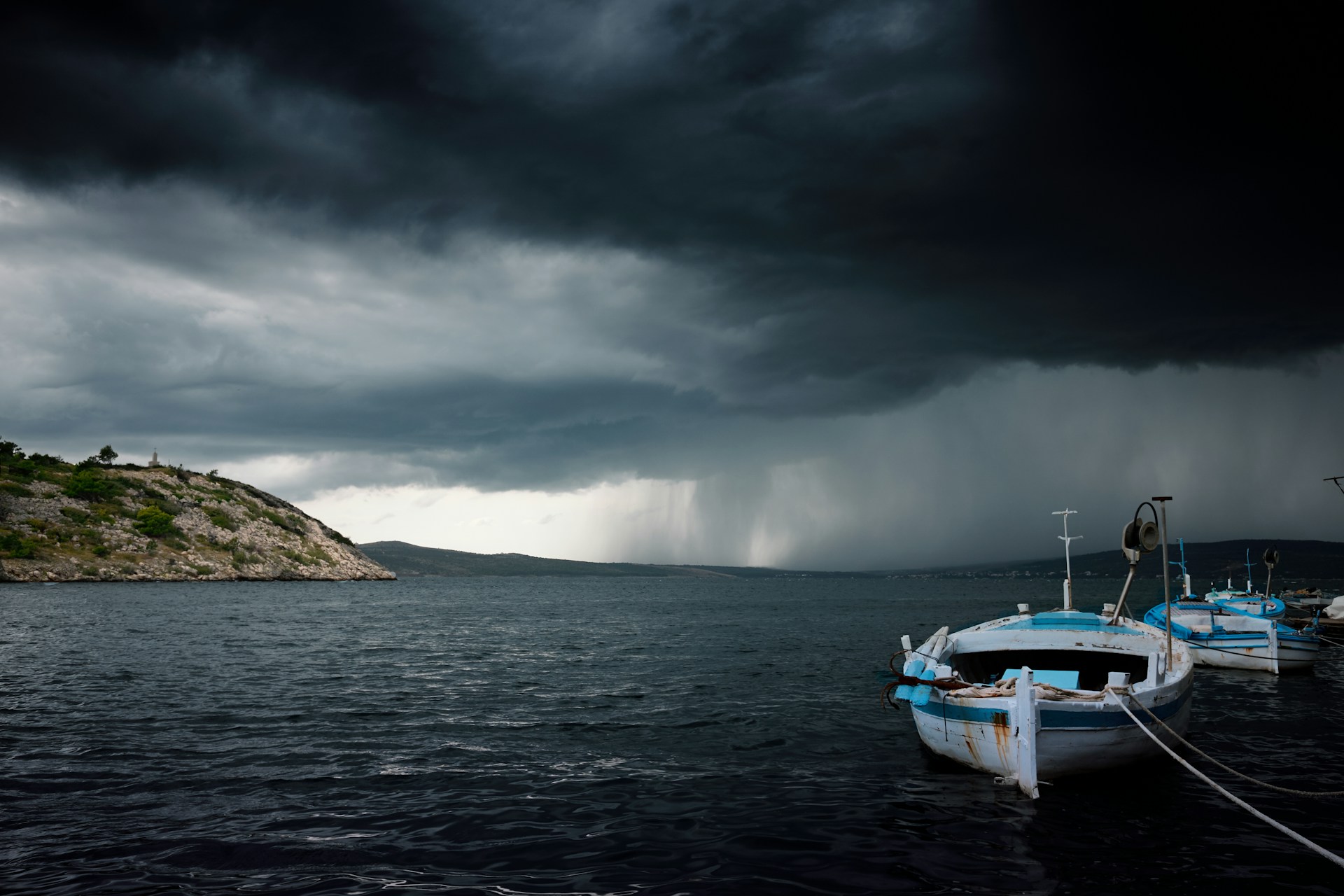 dark rain clouds out at sea