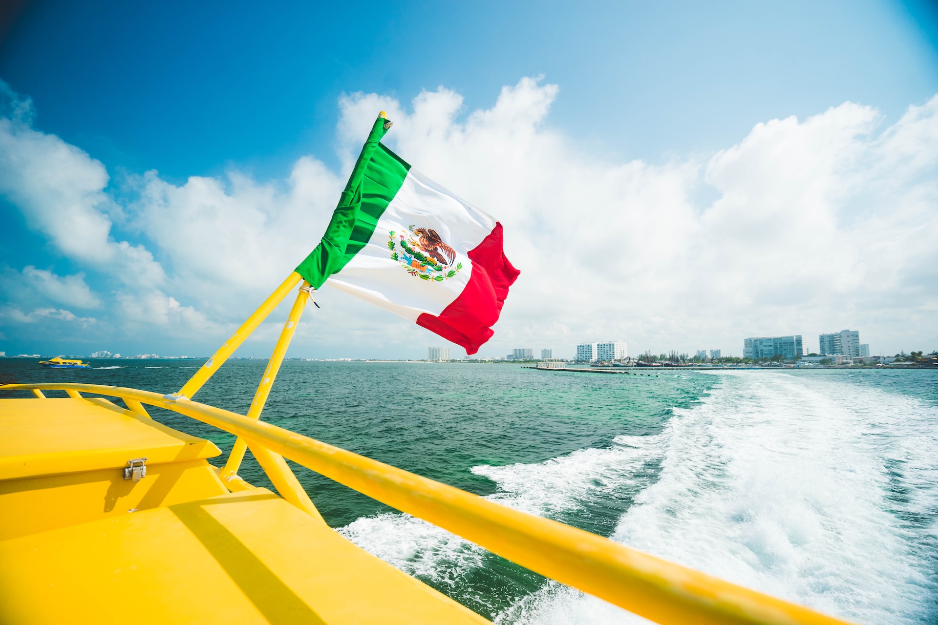 Mexican flag on the back of a boat