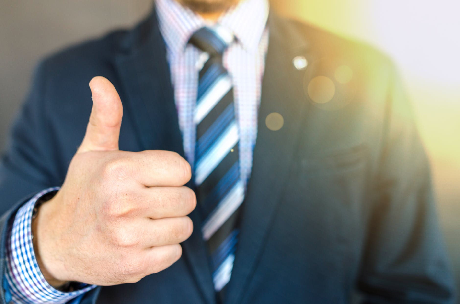 businessman giving thumbs up