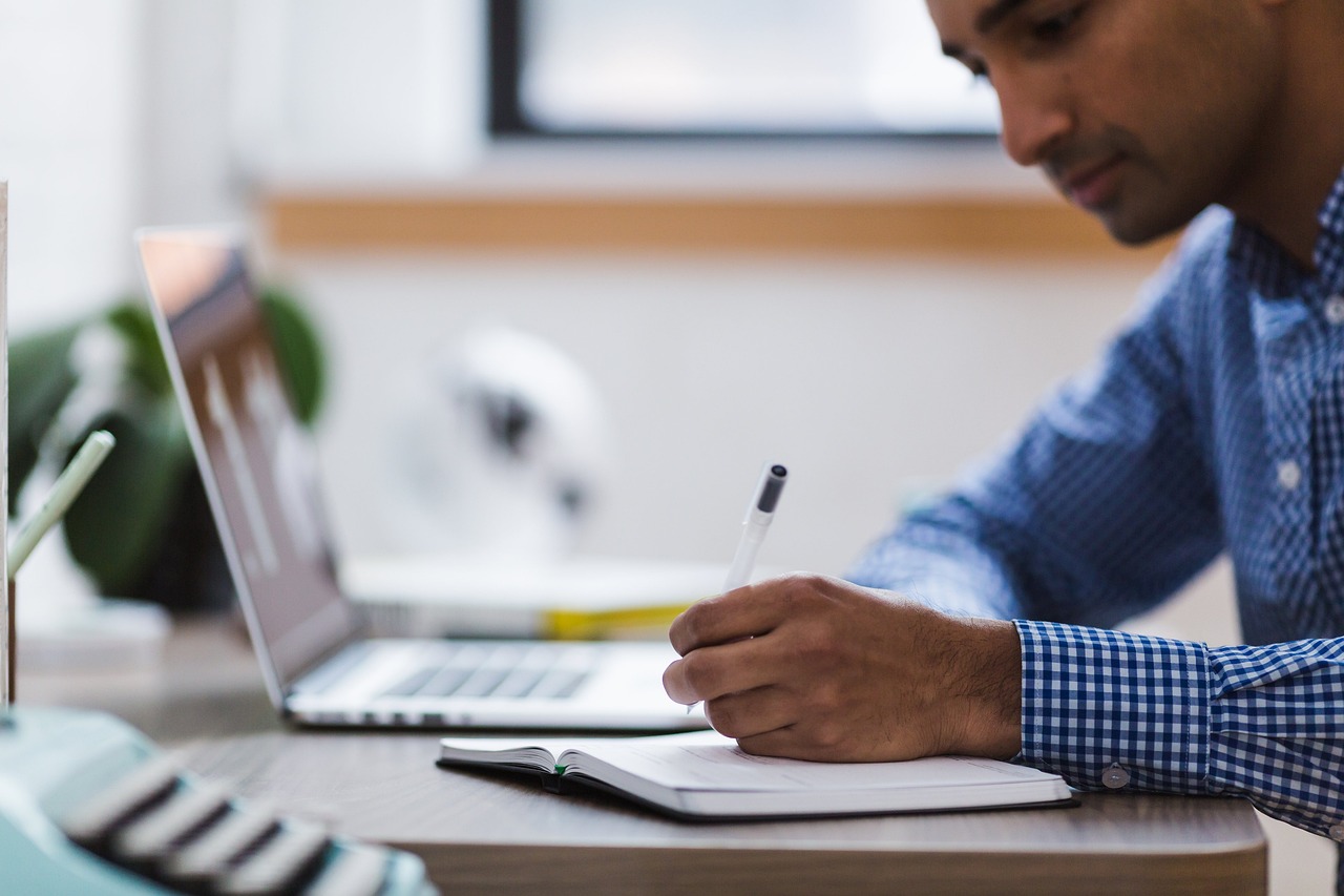 A man studying to aide his search for a maritime job