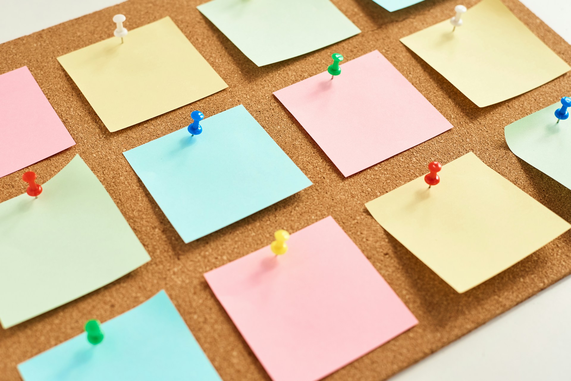 Post-it Notes on a pin board as part of a plan of action to find a job at sea