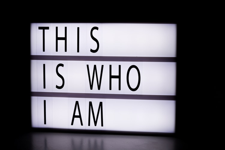 a lightbox sign saying 'this is who I am'