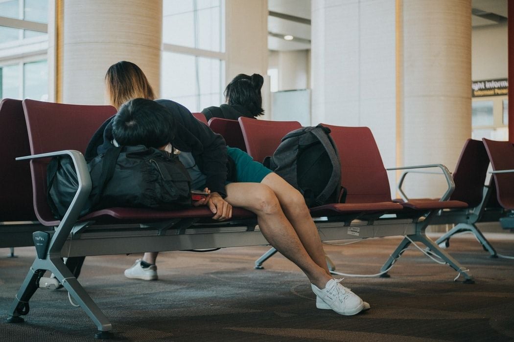 man asleep in airport