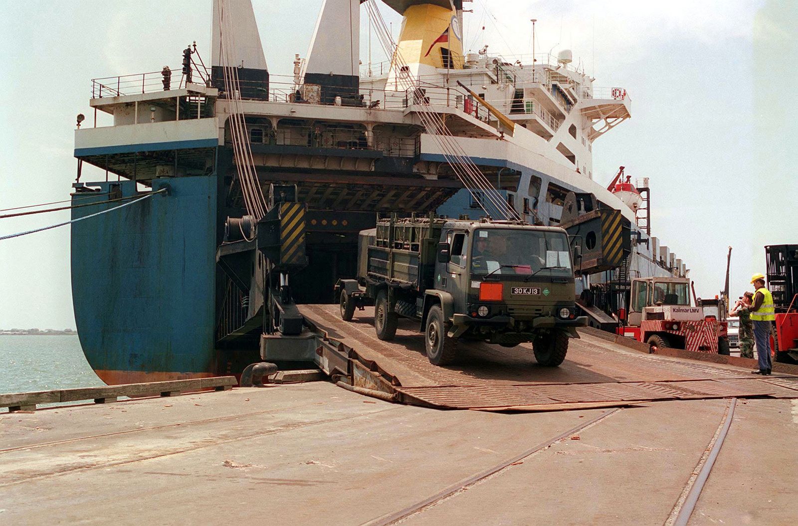 an army truck rolling off a roro vessel