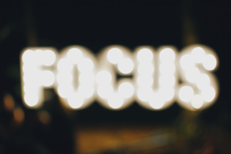 fuzzy illuminated sign saying focus