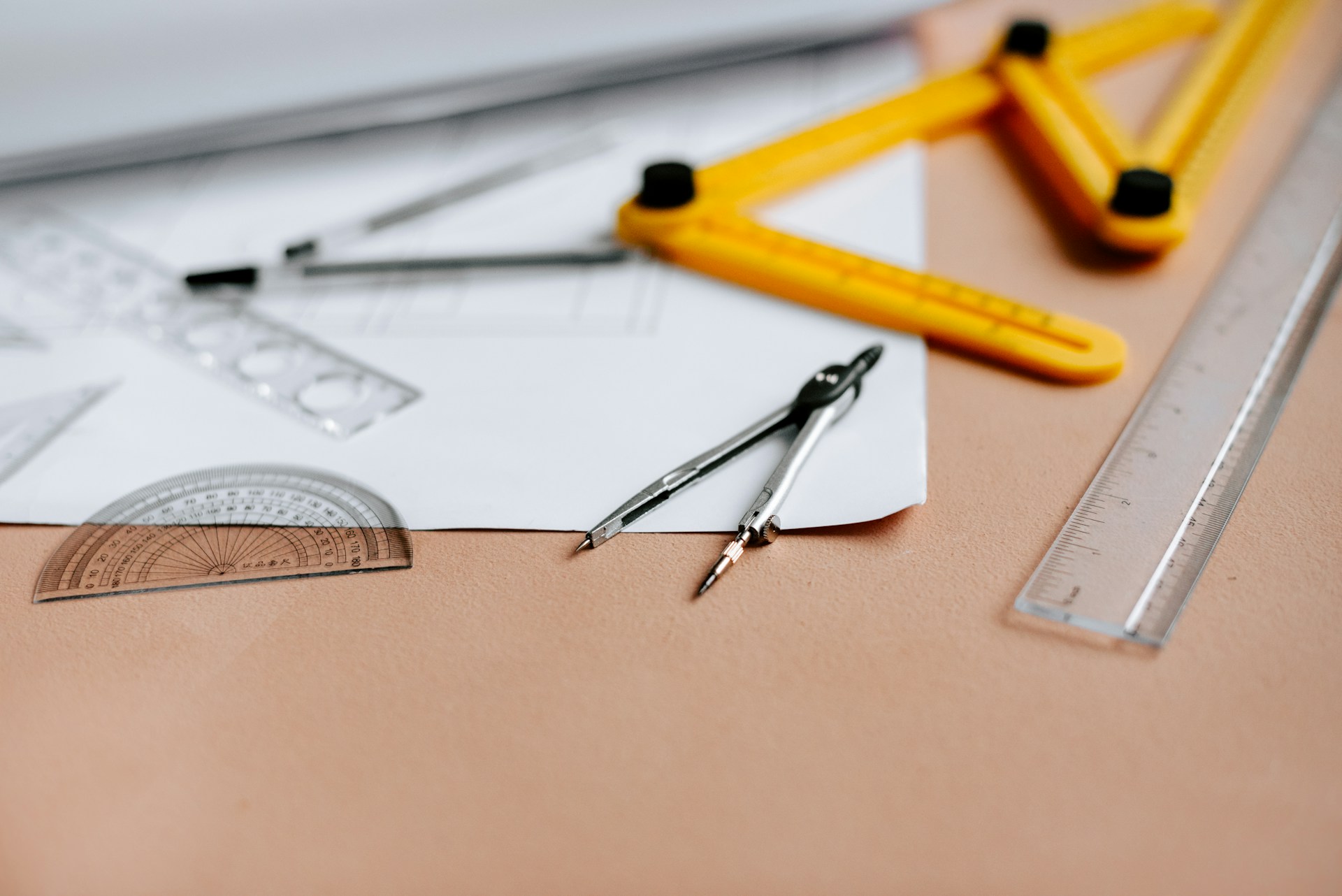 a technical drawing with a compass, ruler, and protractor