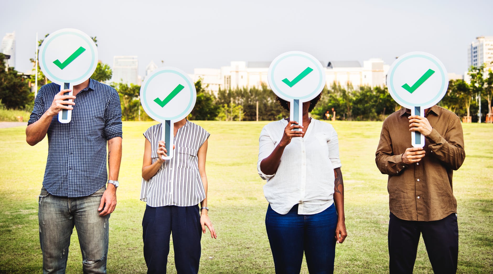 young people holding signs with checkmarks on them indicating a new generation to hire in maritime recruitment