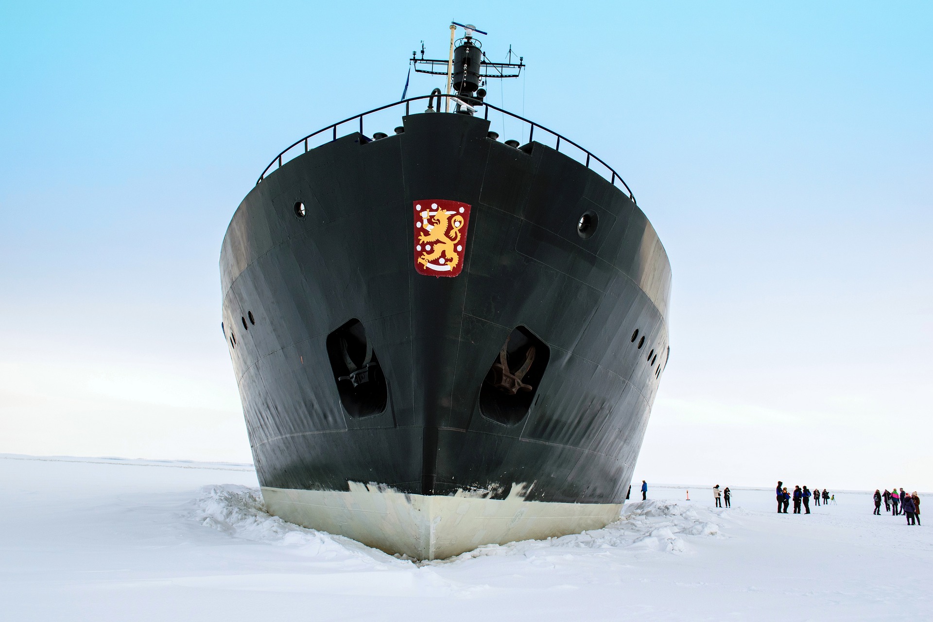 the bow of an icebreaker ship cutting through ice