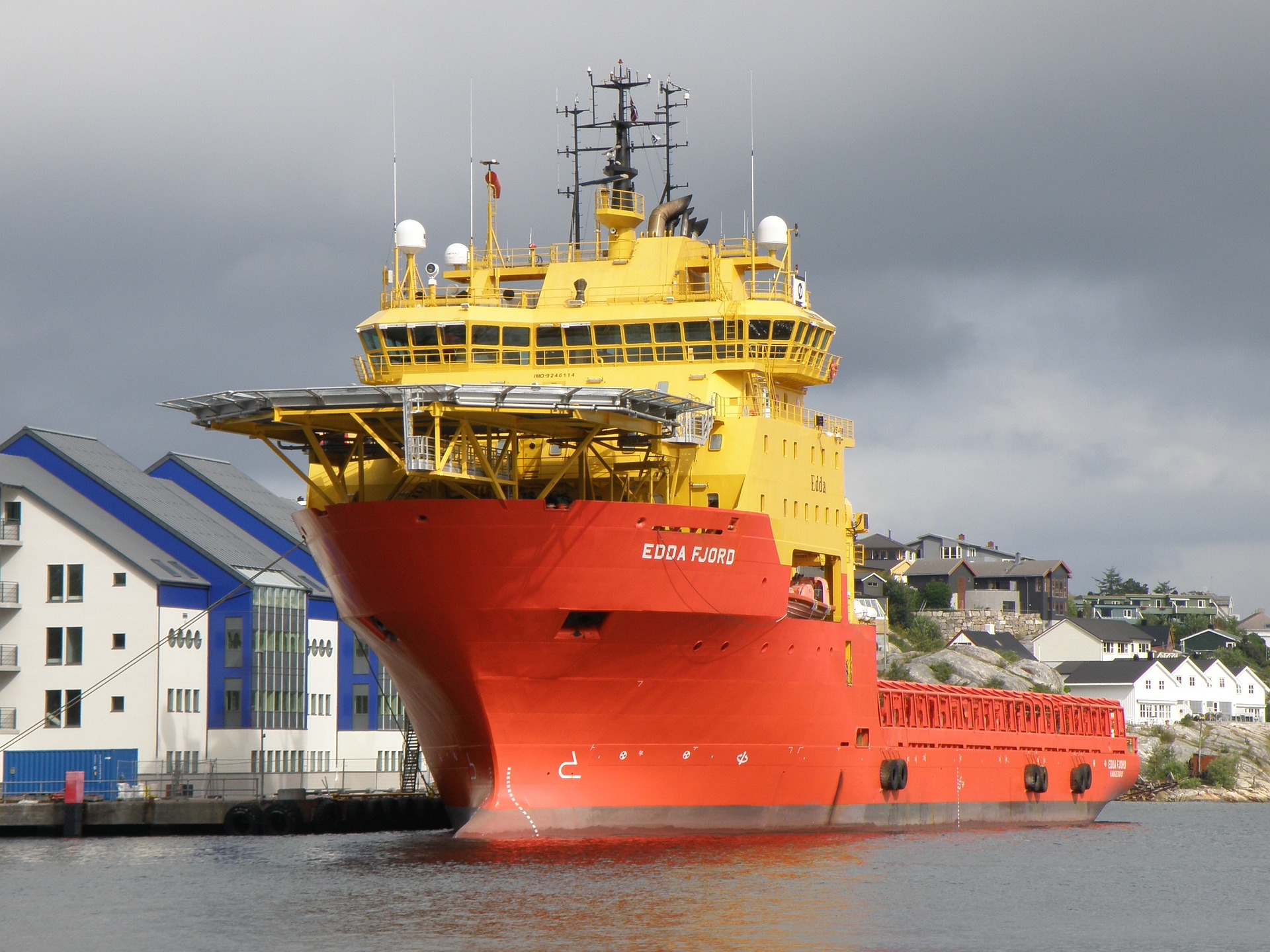 a red and yellow icebreaker ship