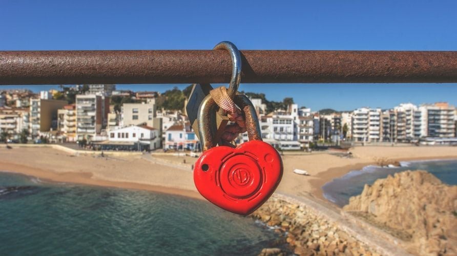 heart padlock in front of beach