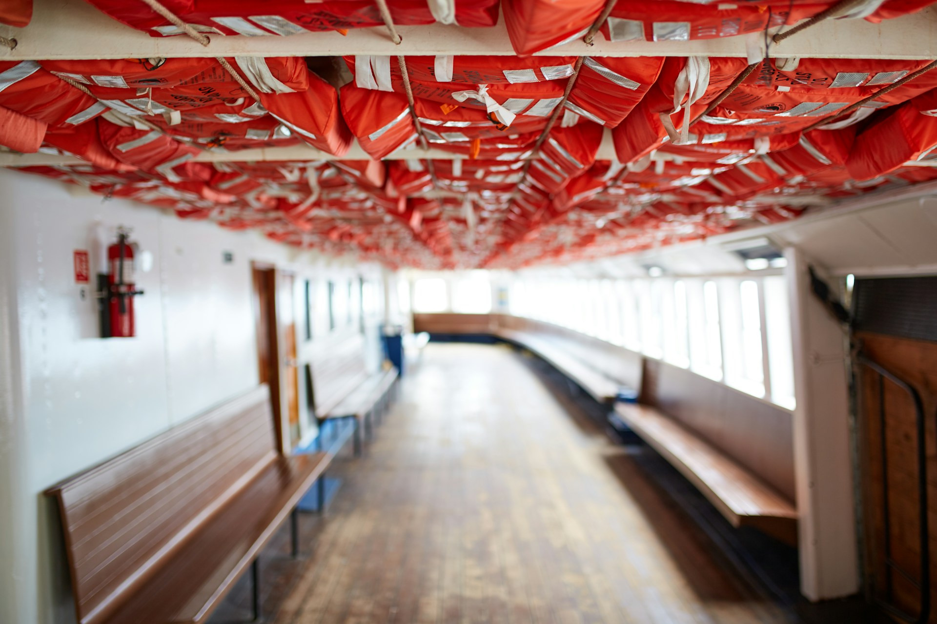 life jackets stored in the ceiling of a ferry