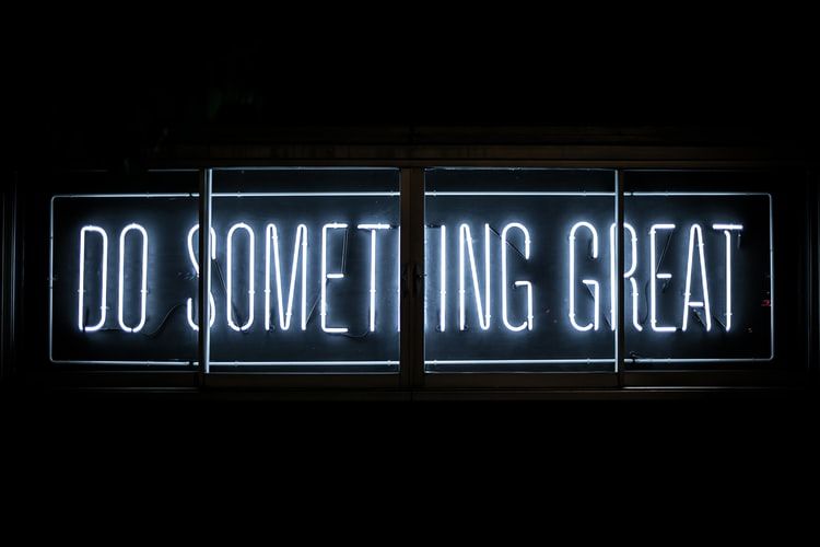 neon sign saying 'do something great'