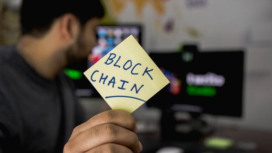 block chain written on post-it note