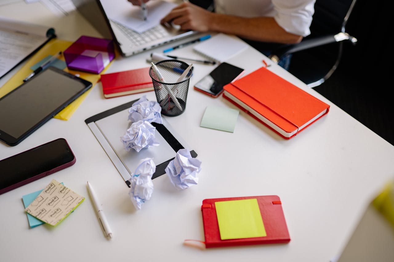 a person working on a messy desk