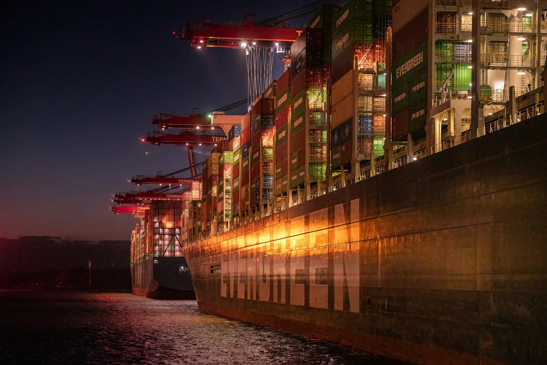 an Evergreen container ship at night