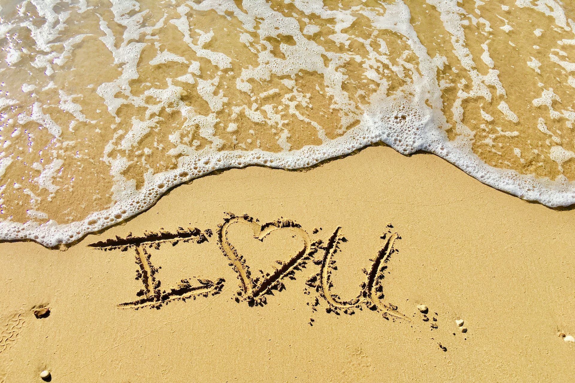 I Heart You written in sand