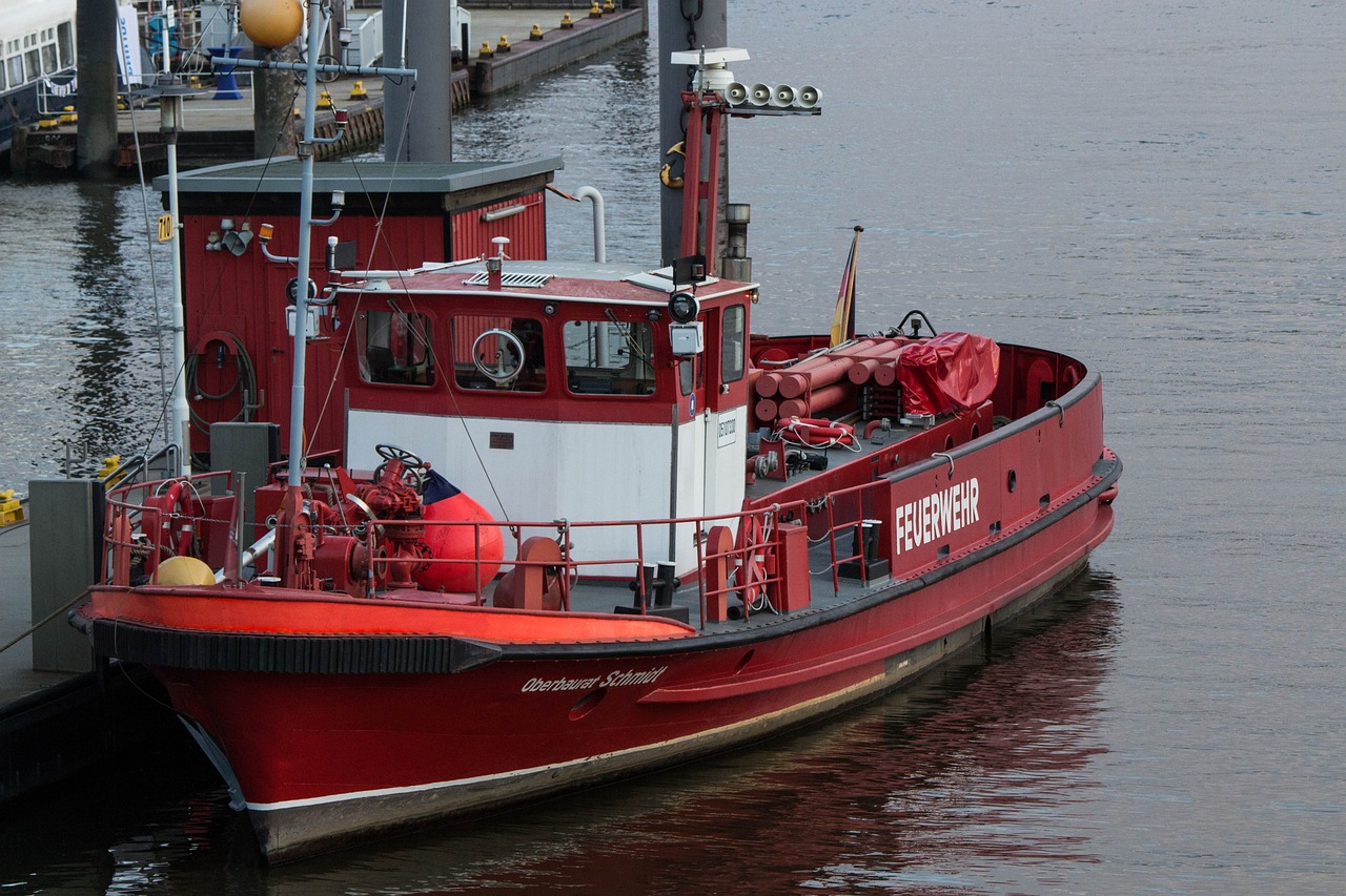 a fireboat moored alongside a dock