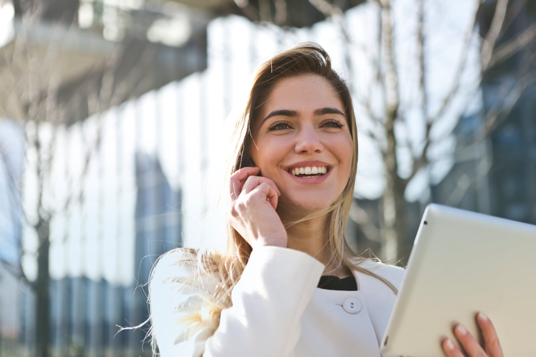 smiling woman on phone