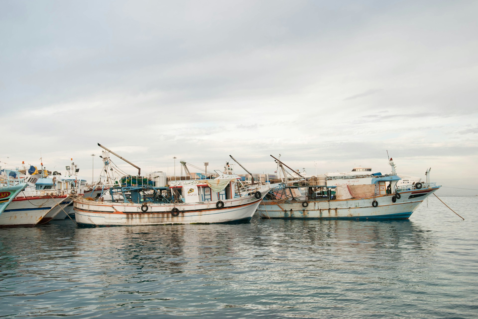 fishing boats moored in a harbor