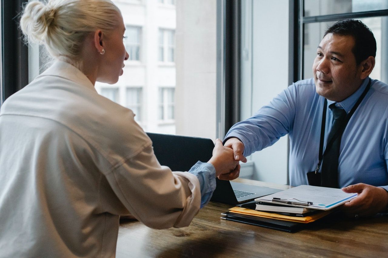 man and woman shaking hands