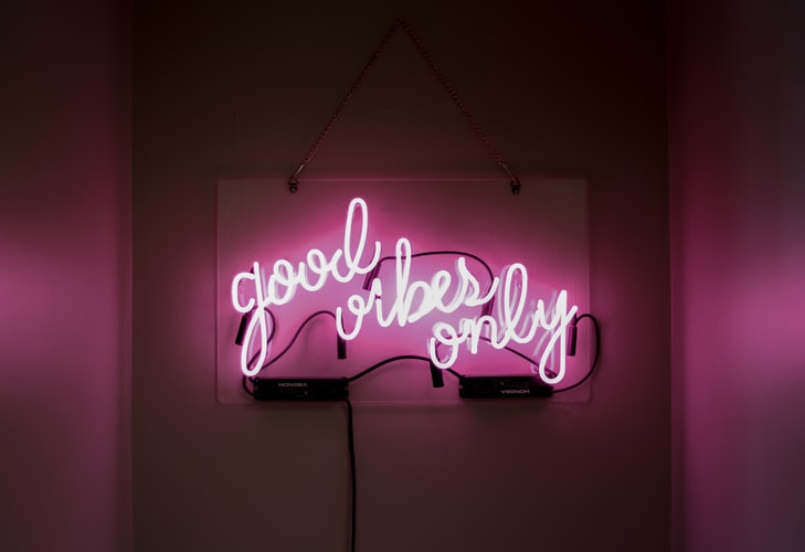 pink neon sign saying good vibes only