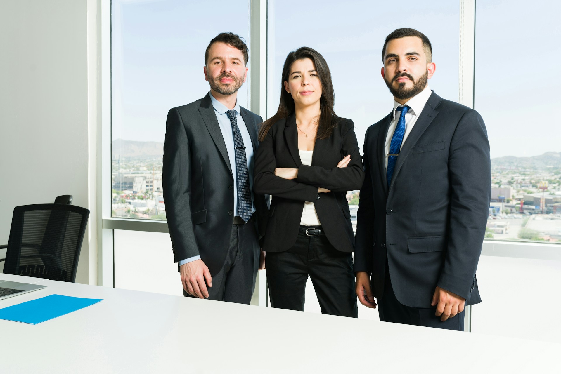 three coworkers standing side by side