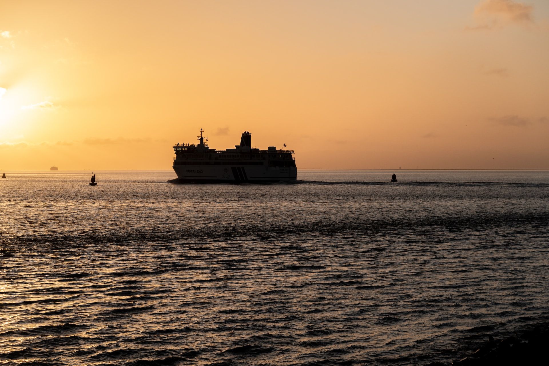silhouette of ship at sunset
