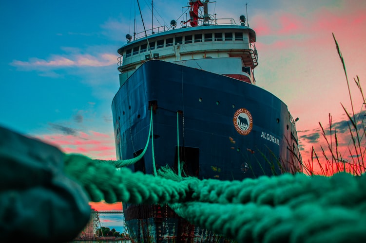 a cargo ship as seen from in front of the bow