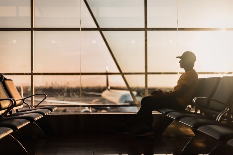 man sitting in airport