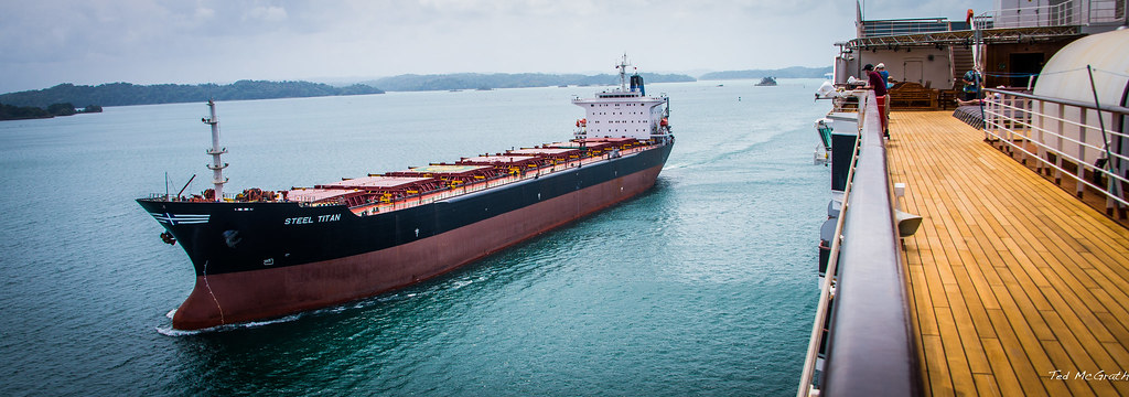 a bulk carrier seen from the deck of another ship