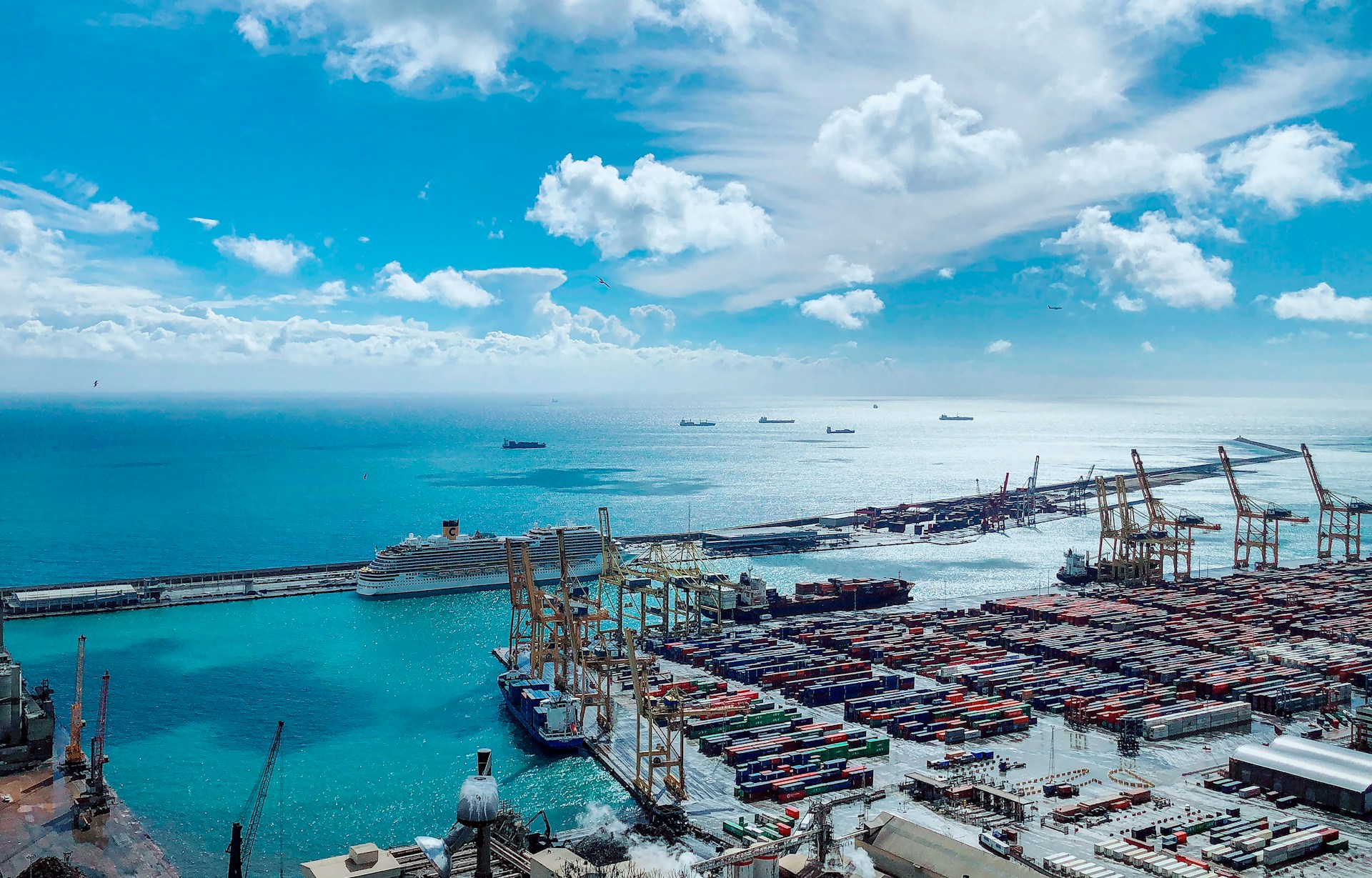 Looking out over a container port towards the ocean